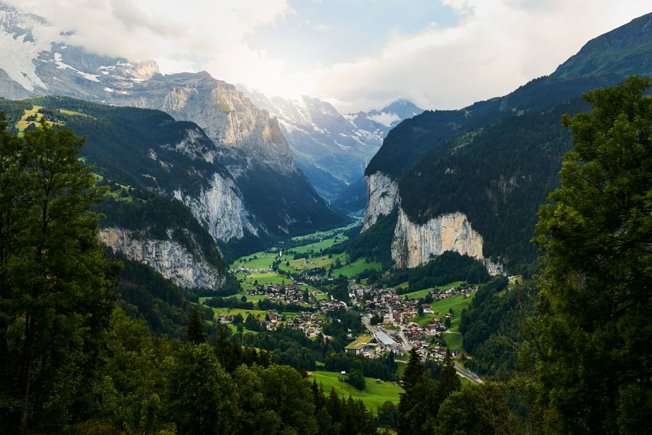 Breathtaking aerial view of Lauterbrunnen Valley surrounded by majestic mountains.
